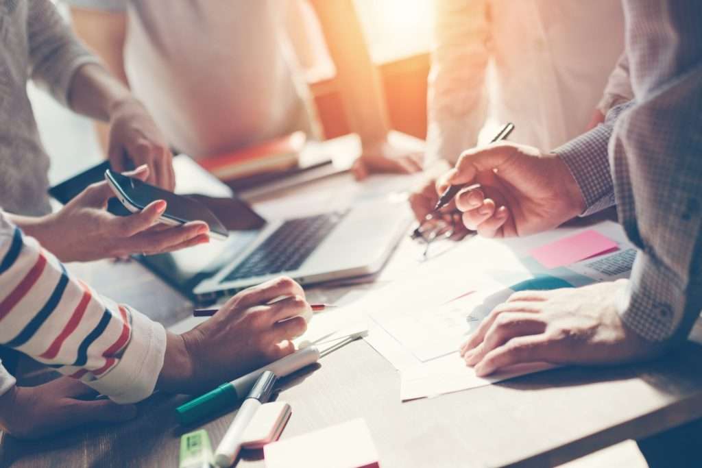 Group of hands Working at a table