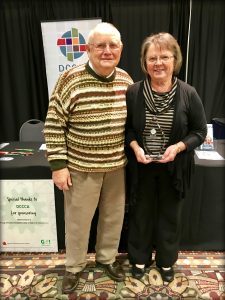 JP and Gloria Leffman holding featured foster parent award